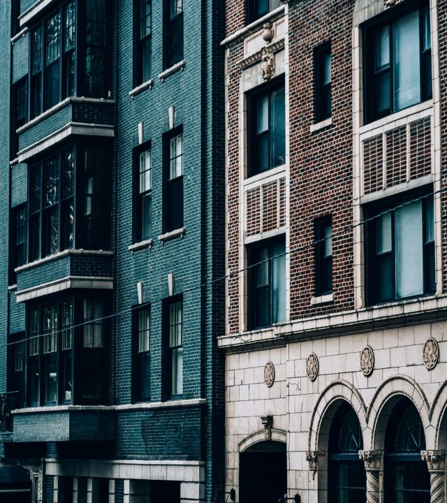 Detailed view of historic and modern architecture in downtown Chicago on a clear day.